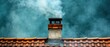 © Inlovehem - Chimney with smoke, rooftop against a colorful sky, abstract view of domestic architecture.