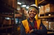 © Vorda Berge - Portrait of a smiling young woman working in a factory