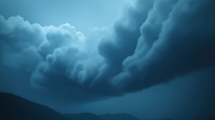 Sticker - Stormy sky with dark clouds and a mountain in the background. Scene is ominous and foreboding