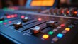 © useful pictures - The audio mixing console is being actively used, featuring colorful illuminated buttons and sliders as sound engineers adjust levels for the recording