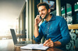 © peopleimages.com - Man, phone call and writing in notebook at cafe with listening, smile and networking with remote work. Person, writer and smartphone for notes, planning or review with creative project at coffee shop