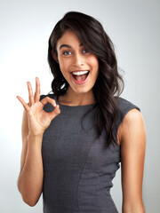 Wall Mural - Business, studio and portrait of happy woman with perfect hand sign, confidence and ok real estate agent. Consultant, realtor or businesswoman with okay gesture, vote or opinion on white background