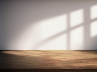 Empty wooden tabletop and a wall with beautiful shadows from the window in the background.