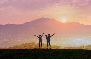 Wall Mural - Happy family facing the sunrise looking to the future 