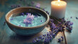 © Kristina - A calming scene of a bowl filled with water, floating lavender sprigs, and a candle nearby, creating a tranquil atmosphere