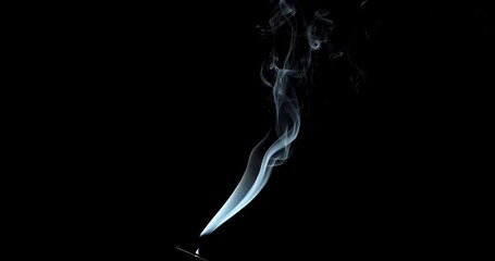 Wall Mural - Real smoke on a black background. Thin Flexible Trickle of Real Smoke. Colorful real smoke rises up. Ideal for background or over-layer with blending mode add, screen, lighten.