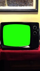 Wall Mural - classic black tv showing green screen - you can replace green screen with the footage or picture you