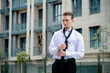 © Elina Leonova - Manager in casual style on city center background