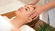 © Prostock-studio - Masseuse hands massaging girl face. Woman closed eyes with pleasure, close up