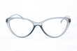 © Tsabit - Silver-colored women's glasses in the middle of a white background