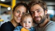 © LifeMedia - A close-up view of a joyous family with parents and their young child, capturing a moment of love, contentment, and togetherness in a warm setting.
