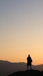 © iLegal Tech - a man standing on a mountain top at sunset