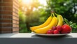 © Cherrin - A vibrant plate of yellow bananas and fresh strawberries, set against a sunlit green background, conveying freshness and healthy eating.