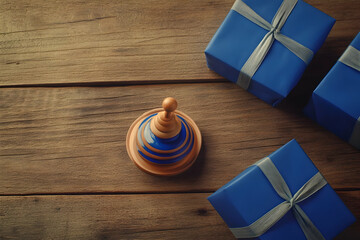 A colorful spinning top surrounded by blue wrapped gifts on a wooden surface.