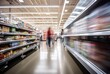 © Riz - Blurred Motion of Shoppers and Products in a Grocery Store Aisle