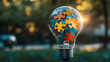 © sasisom - A light bulb made of colorful puzzle pieces symbolizing innovative ideas and creativity