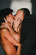 © Volodymyr - The kiss. Romantic lovers kissing. Tender kiss. Man kissing a woman. Kissed lovers. Studio portrait of kissing couple. Sexy young couple kissing each other. Relationship bonding. Couple in love
