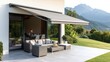 © JAYDA RIN - Motorized retractable awning extending over a stylish patio with furniture, Outdoor luxury, sun protection