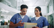 © D Lahoud/peopleimages.com - Team, nurse and folder with discussion for medical history, patient results or application at hospital. Man, woman or healthcare workers with documents or paperwork for health procedure at clinic