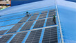 © ultramansk - Worker Technicians are working to construct solar panels system on roof. Installing solar photovoltaic panel system. Men technicians walking on roof structure to check photovoltaic solar modules.