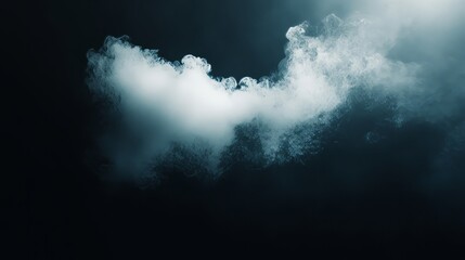A soft, dreamy white cloud glowing gently against a deep black background