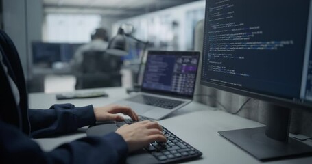 Close Up on Hands of an Anonymous Female Engineer Working on Desktop Computer in a Technological Corporate Agency. Specialist Writing Software Code for an Artificial Intelligence Training Model