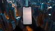 © PSCL RDL - A blank smartphone screen held by a person with a lively cityscape in the background, ideal for showcasing mobile apps