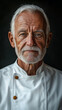 © ekampos - A portrait of an elderly man with chef uniform