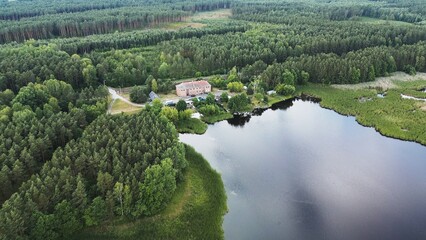 Wall Mural - Aerial view of the forested lake. Wilderness