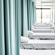 © Photography09 - Hospital ward with several beds, curtains drawn for privacy, hospital room, patient care