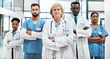 © peopleimages.com - Doctors, confidence and woman in portrait with arms crossed, leadership and support in healthcare. Hospital, diversity and serious medical team with nurses, pride or group of people in solidarity