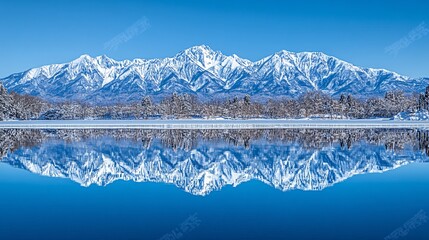 Fototapete - Alpine lake with clear water reflecting snow-capped mountains under a cloudless sky capturing pure tranquility with side empty space for text Stockphoto style