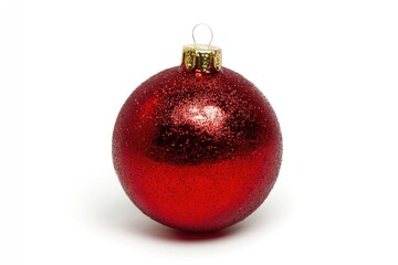 Poster - A small, shiny red Christmas ornament on a white background