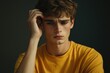 © Vii - A young man holding his head in distress