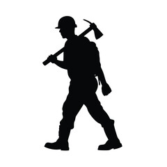 Wall Mural - A man is holding a pickaxe and walking on a rock. He is wearing a helmet