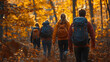 © MK studio - A group of friends hikes along a forest path in autumn, surrounded by brilliant orange and yellow leaves, as soft sunlight filters through the trees.
