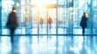 © YURIMA - The modern business entrance features blurred figures, bright lighting, and an atmosphere that promotes collaboration and communication among professionals in a vibrant urban environment