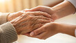 © Unslux - giving help a young girl holding old people hand. An elderly care love support with sunset background.