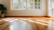 © JoxyAimages - A spacious empty room with warm sunlight streaming through a large window, highlighting the polished hardwood floor and a potted plant in the corner, creating a serene atmosphere.
