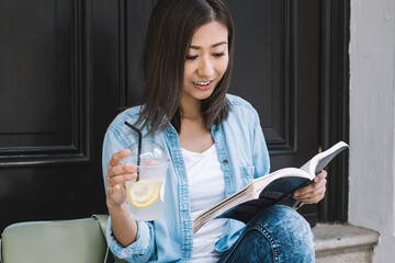 Wall Mural - Happy Asian student during reading book