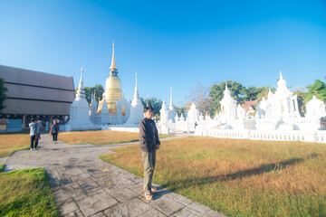 Wall Mural - Beautiful photographer backpack women take photo travel in buddha temple