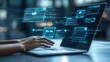 © AiPhotoSale - A person is engaged in typing on a laptop while a futuristic digital interface appears above the keyboard.