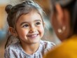 © Bijac - joyful child eagerly meeting a caregiver, with a bright smile lighting up her face, capturing the heartwarming connection between them in a vibrant healthcare setting