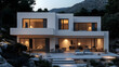 © bcendet - Modern white house with large windows and a patio illuminated by warm lighting in the evening, surrounded by a rocky hillside and trees.