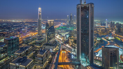 Wall Mural - Dubai Downtown day to night timelapse modern towers panoramic view from the top in Dubai, United Arab Emirates.