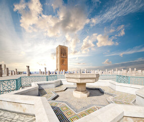 Tour Hassan tower in the square with stone columns. Made of red sandstone, important historical and tourist complex in Rabat, Morocco. Instead of stairs, the tower is ascended by ramps