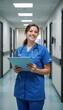 © Annetka - Smiling nurse in hospital hallway with clipboard