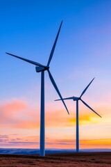 Canvas Print - An aerial view of wind turbines silhouetted against a countryside landscape at sunset. A wind power plant generating clean energy. Sustainable and renewable energy concept.