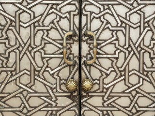 Decorated door of Hassan II mosque in Casablanca, Morocco. Arabic oriental styled door Classic Blue Pantone color in Morocco