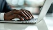 © Chotijah - Close-up of Hands Typing on a Laptop Keyboard